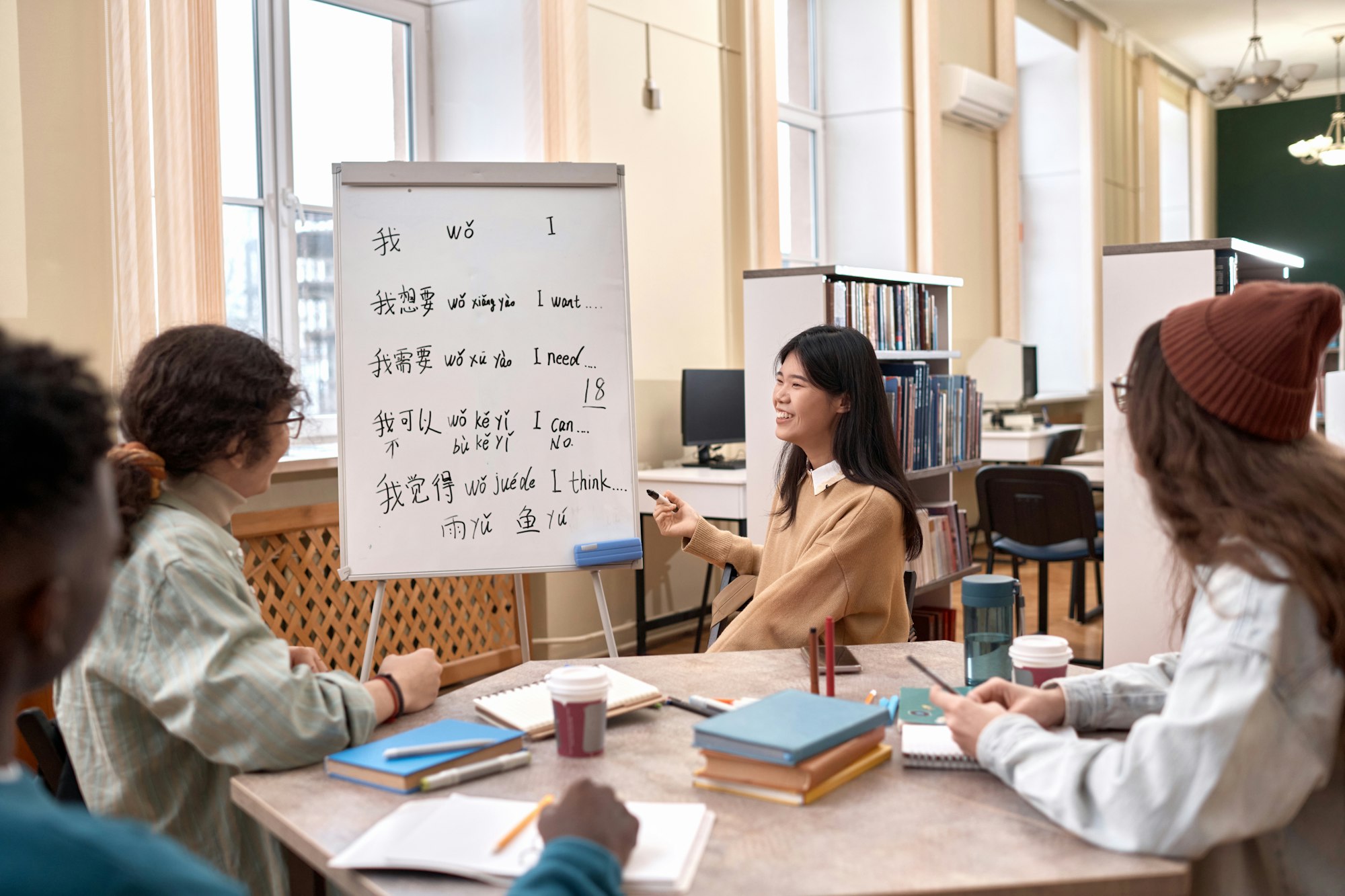 Smiling Asian Woman Teaching Chinese Class